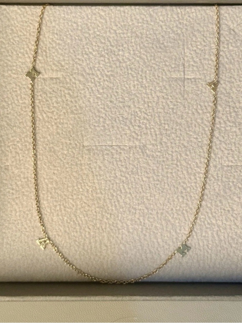 Zoe Chicco Gray Box with Gold Logo